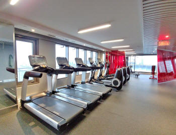 Gym in Le Peterson at 405 de la Concorde overlooking the Quartier des Spectacles
